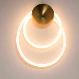 Lámpara led de pared Loop brass con luz cálida